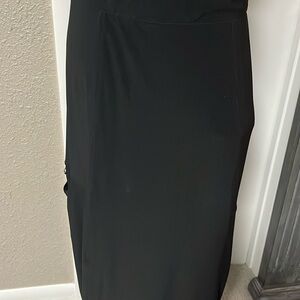 Ankle length, black, beautiful skirt with pockets at the knees and a drawstring